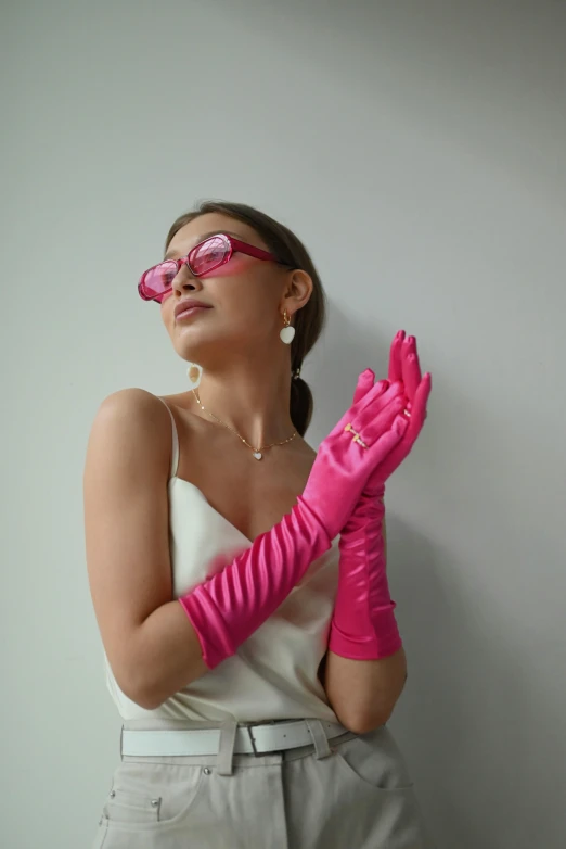 a woman wearing a pair of pink gloves, inspired by Gustave Boulanger, instagram, pink glasses, white satin gloves, y2k design, plastic skin