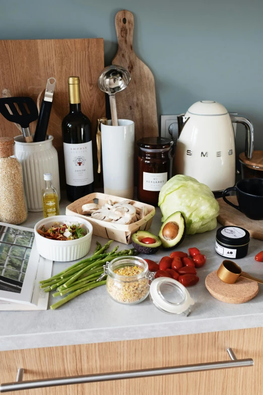 a counter topped with lots of different types of food, a still life, inspired by Eden Box, white wine bottle, dwell, medium, soup