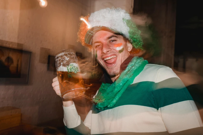 a man in a green and white striped shirt holding a glass of beer, pexels contest winner, wearing a fancy dress, avatar image, irish, hibited