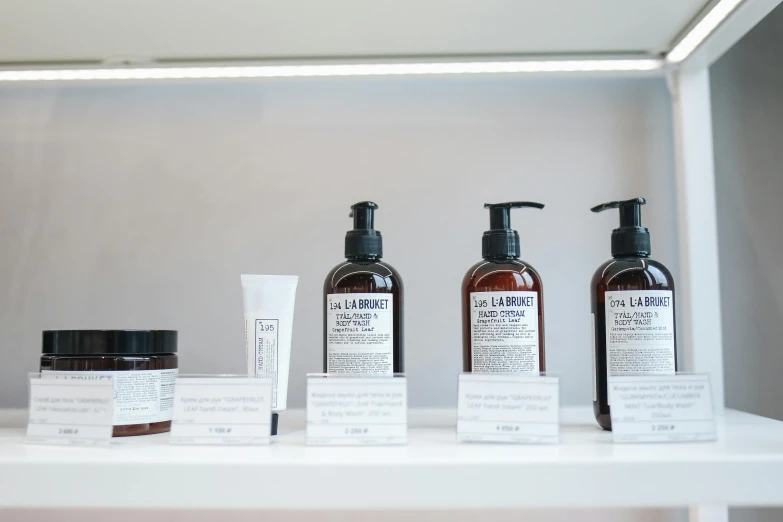 a shelf filled with different types of skin care products, bauhaus, brown, low detail, displayed, original style