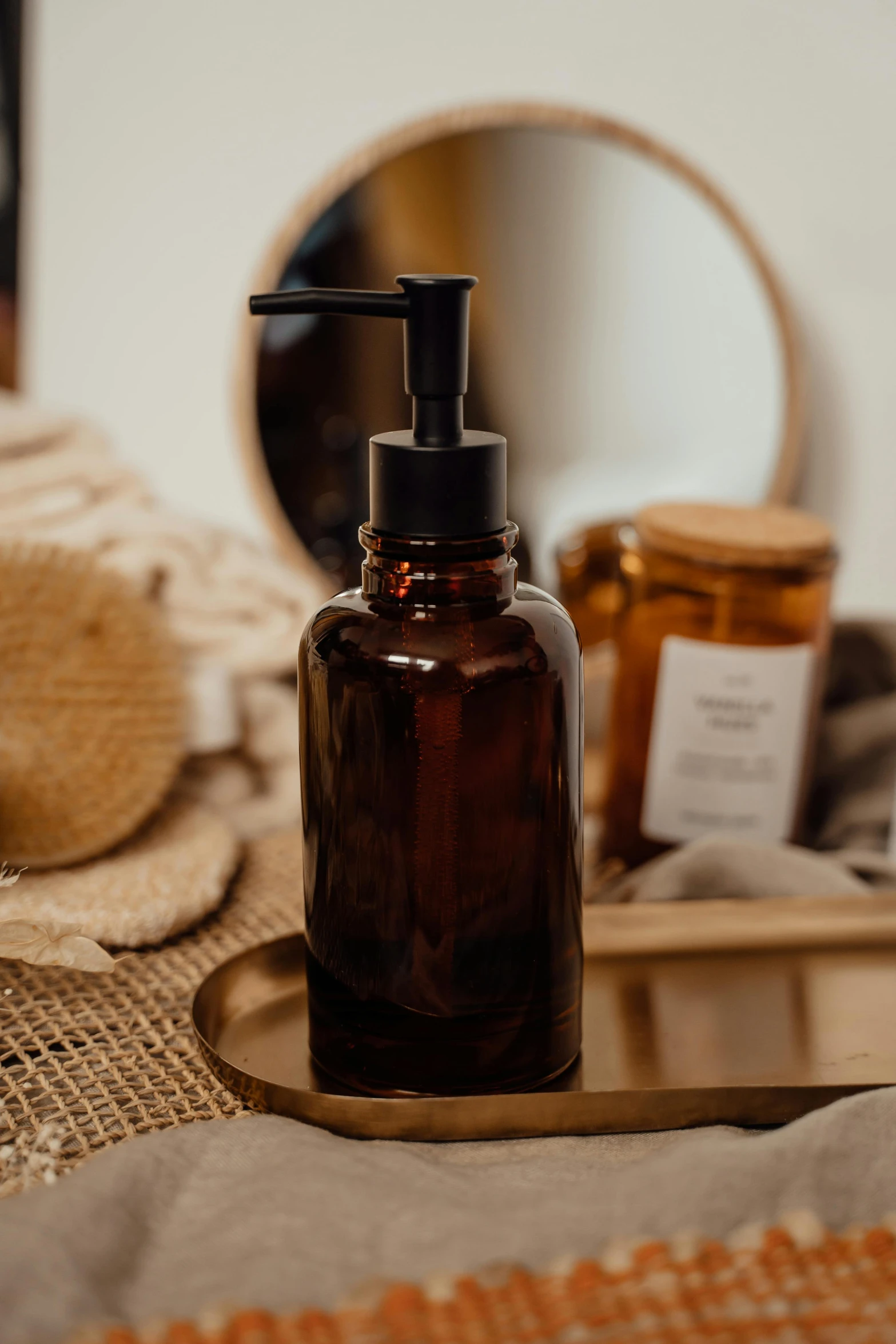 a bottle of liquid sitting on top of a table, pexels, photoshoot for skincare brand, on a wooden tray, amber, shelf