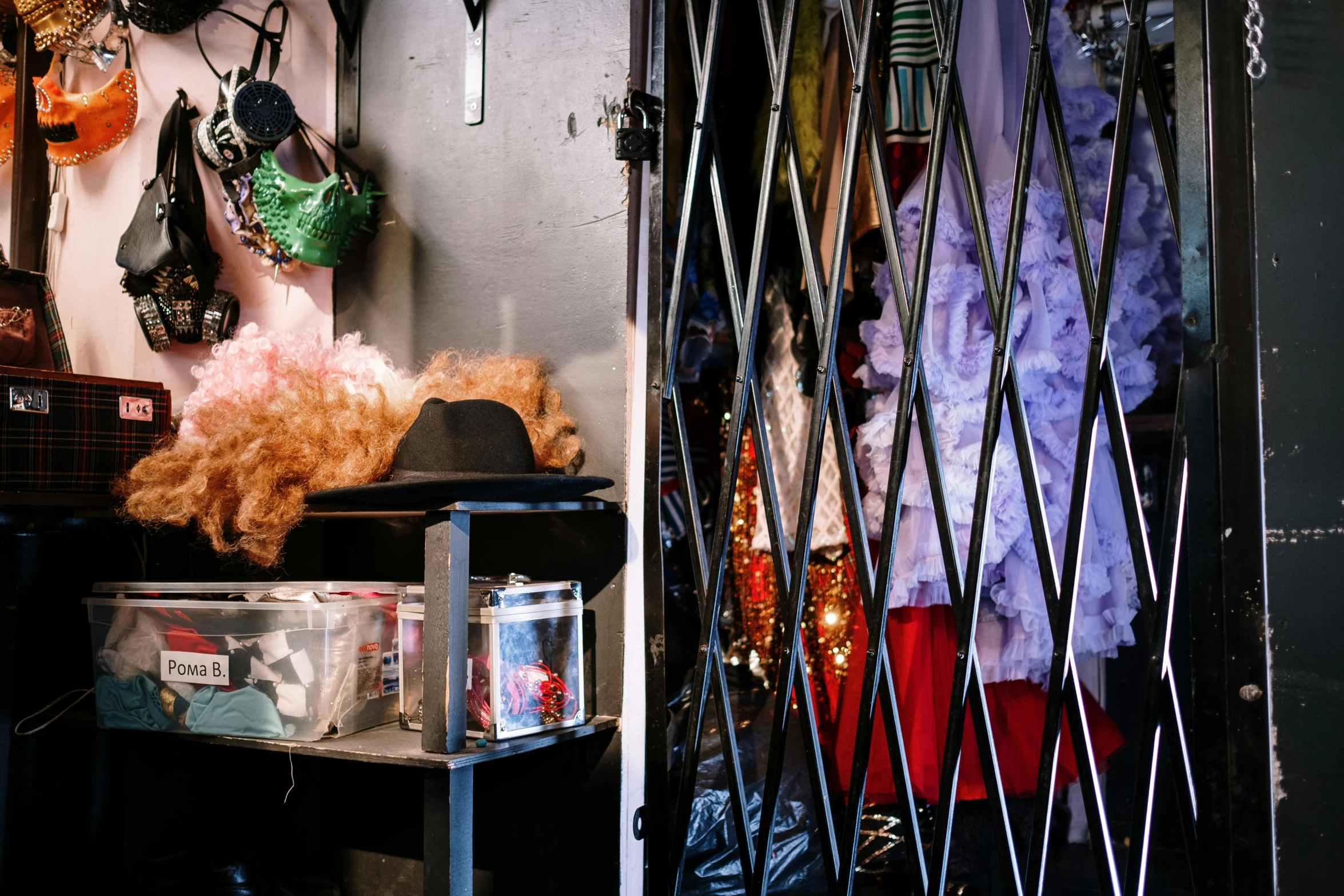 a closet filled with lots of clothes and a teddy bear, by Elsa Bleda, renaissance, dive bar with a karaoke machine, inside a circus tent, drag queen, inside of a tokyo garage