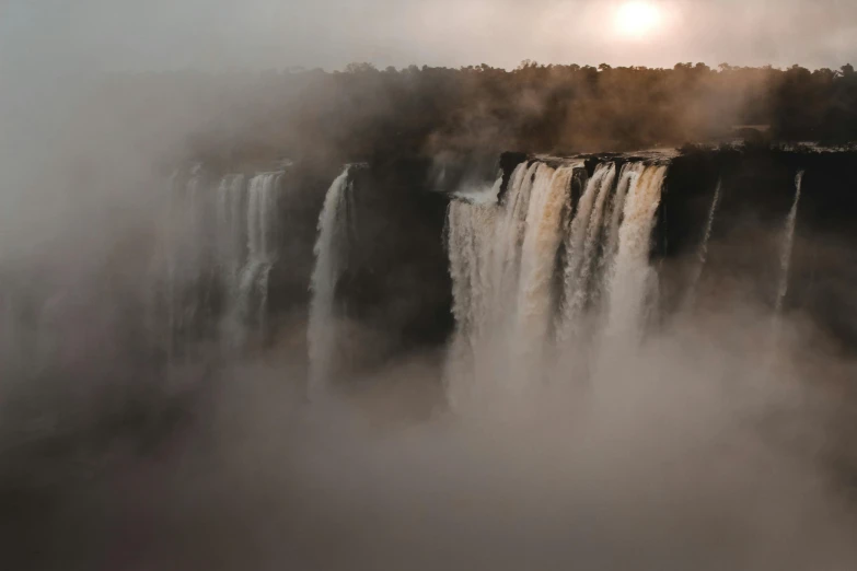 a view of the victoria falls in victoria falls national park, victoria falls, victoria falls, victoria falls, victoria falls, victoria falls, victoria, a polaroid photo, by Matija Jama, pexels contest winner, romanticism, foggy sunset, youtube thumbnail, unsplash photography, ground mist