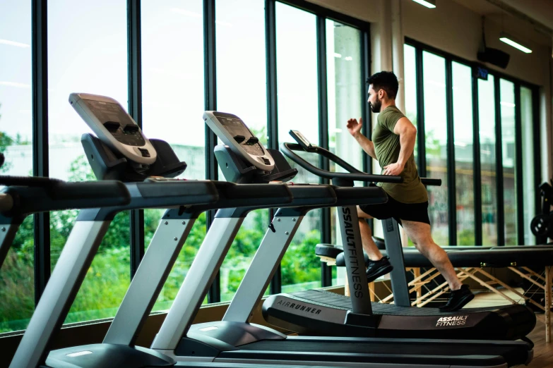 a man running on a treadmill in a gym, by Carey Morris, pexels contest winner, renaissance, lush environment, thumbnail, full colour, athletic crossfit build