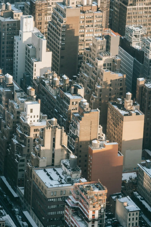 a view of a city from the top of a building, new york buildings, zoomed in, buildings covered with greebles, ignant