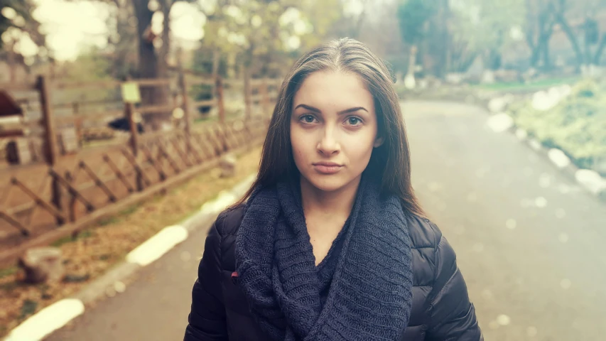 a woman standing on the side of a road, a portrait, by Lucia Peka, unsplash, realism, beautiful grumpy girl, in a park, 🤤 girl portrait, beautiful iranian woman