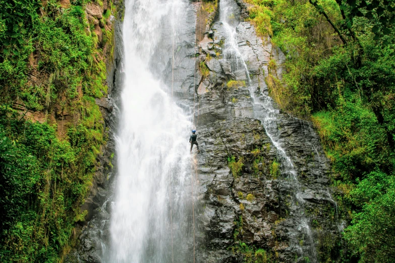 a man that is standing in front of a waterfall, climbing, ayahausca, profile image, seen from above