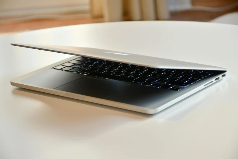 a laptop computer sitting on top of a white table, by Carey Morris, 15081959 21121991 01012000 4k, closeup - view, high-quality photo, rectangle