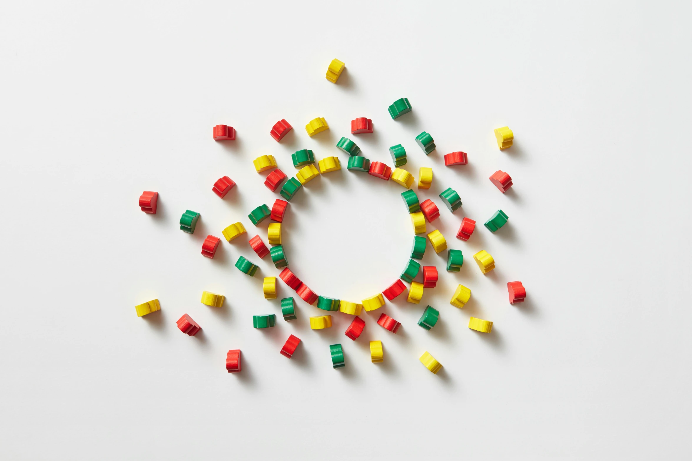 a circle made out of legos on a white surface, an abstract sculpture, inspired by Cerith Wyn Evans, pexels contest winner, red green yellow color scheme, octagon render 8k, dust around, squares