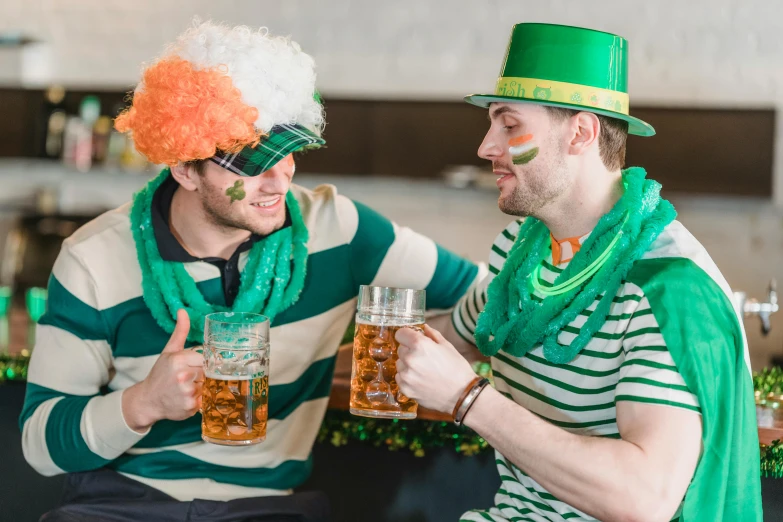 two men dressed up for st patrick's day drinking beer, pexels, stripes, 🦩🪐🐞👩🏻🦳, oh the places you'll go, lachlan bailey