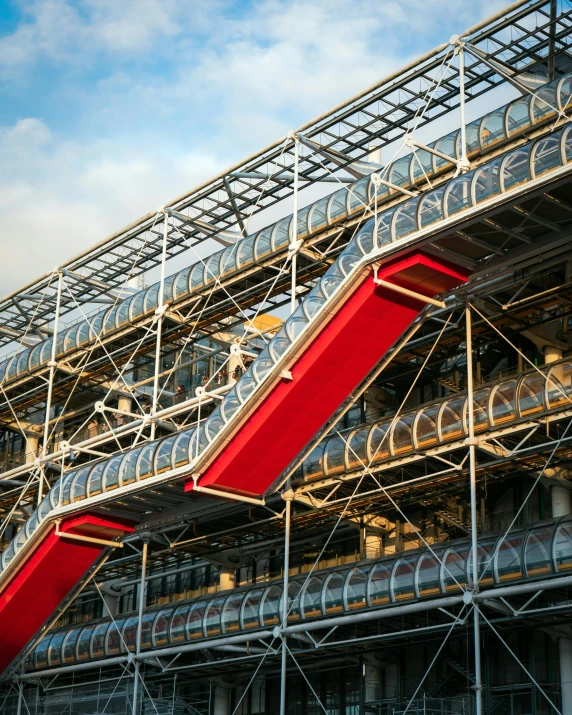 a red staircase going up the side of a building, inspired by Victor Enrich, unsplash contest winner, hanging in the louvre, large pipes, construction site, lgbtq
