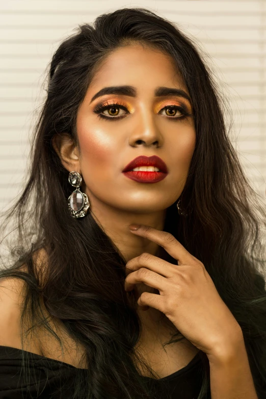 a woman in a black dress posing for a picture, inspired by Saurabh Jethani, hurufiyya, brown skin. light makeup, detailed face with red lips, promo image, square