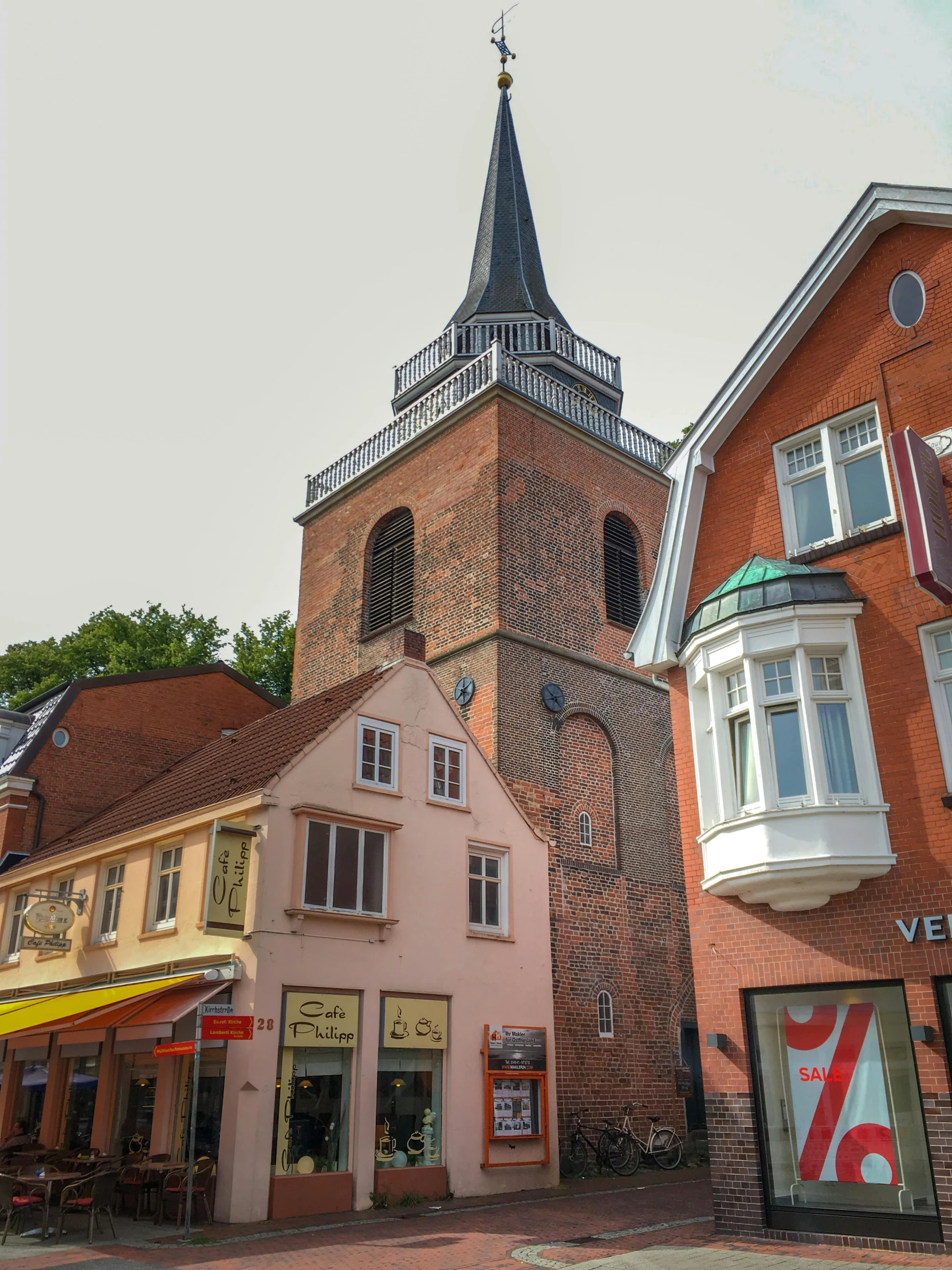 a couple of buildings that are next to each other, inspired by Wilhelm Marstrand, pexels contest winner, romanesque, lower saxony, today\'s featured photograph 4k, lead - covered spire, colonial era street
