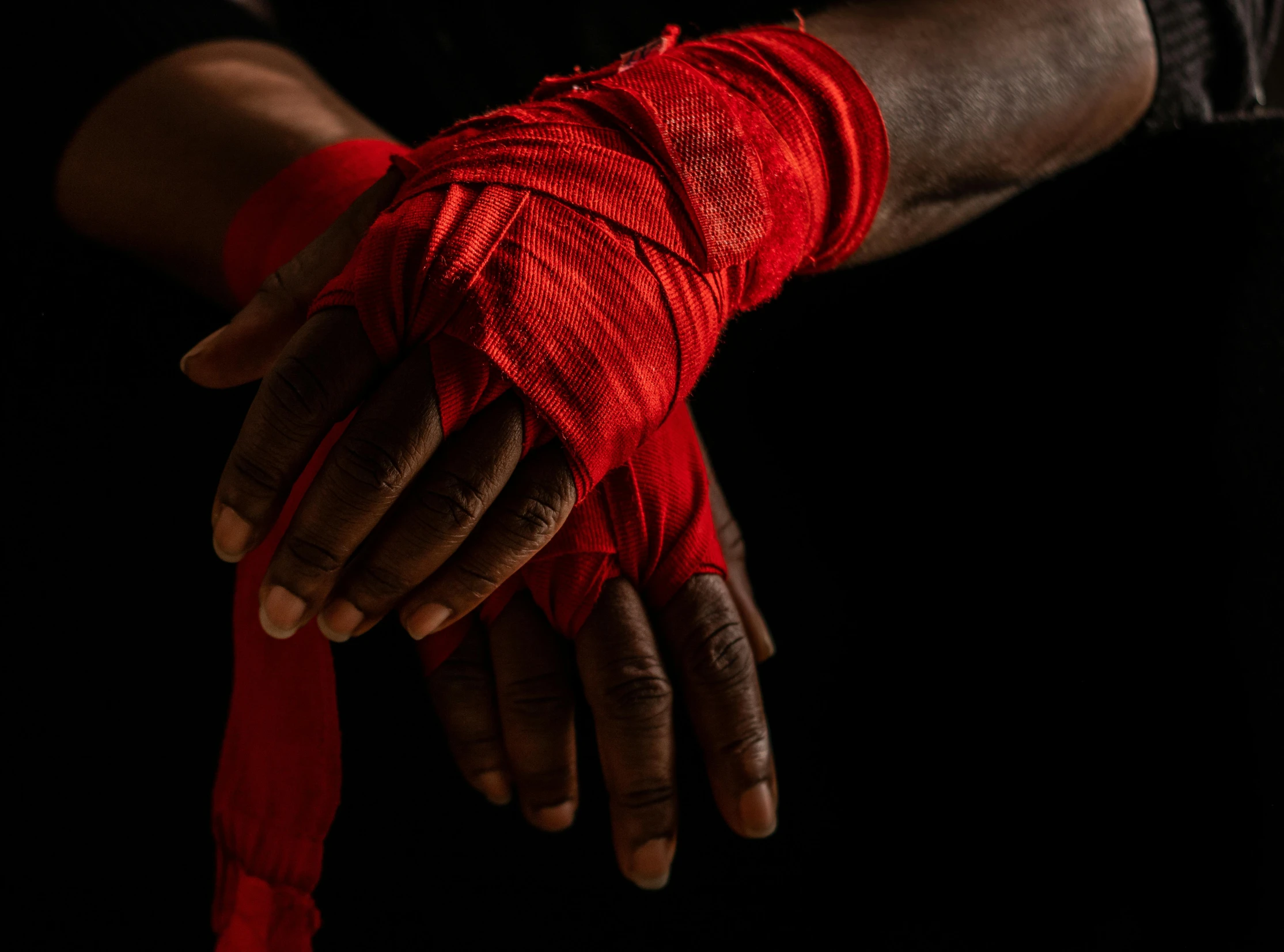 a close up of a person's hands wrapped in red bandages, pexels contest winner, hurufiyya, posing ready for a fight, mapplethorpe, thumbnail, laced