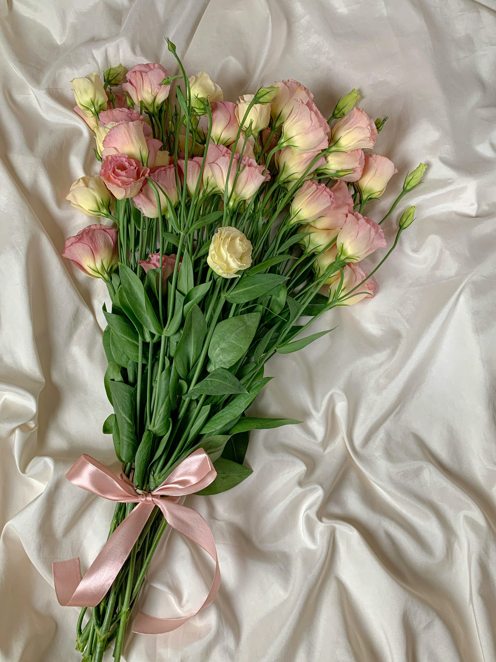 a close up of a bunch of flowers on a bed, covered with pink marzipan, ( ultra realistic ), wrapped, blushing