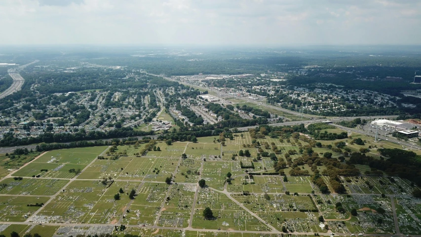 an aerial view of a cemetery in a city, by Everett Warner, 2 0 2 2 photo, memphis, slide show, low quality photo