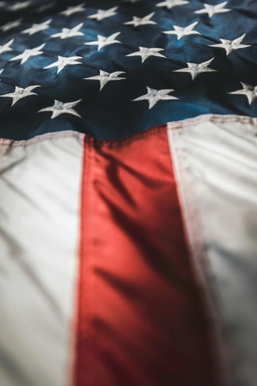 an american flag laying on top of a bed, trending on unsplash, portrait closeup, digital image, multiple stories, insignia