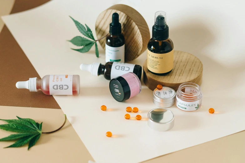 a couple of bottles of cbd sitting on top of a table, by Julia Pishtar, trending on pexels, lyco art, candy treatments, some of them use gask mask, profile image, sprays