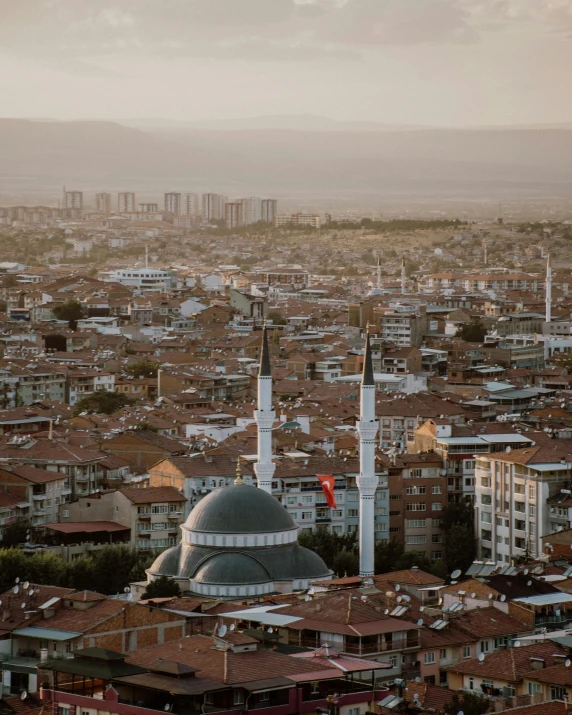 a view of a city from the top of a building, a colorized photo, unsplash contest winner, hurufiyya, turkish and russian, town in the background, mosque, wide film still