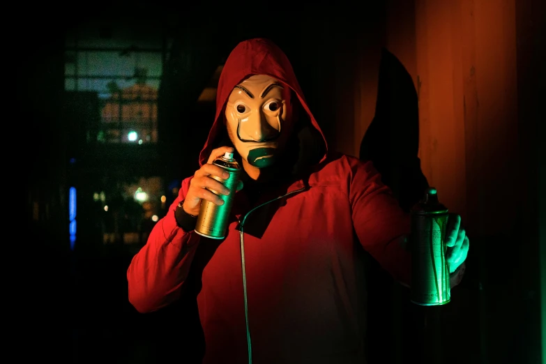 a man in a red hoodie holding a can of beer, a picture, by Adam Marczyński, pexels contest winner, elaborate lights. mask on face, among us imposter, ( ( theatrical ) ), crimes
