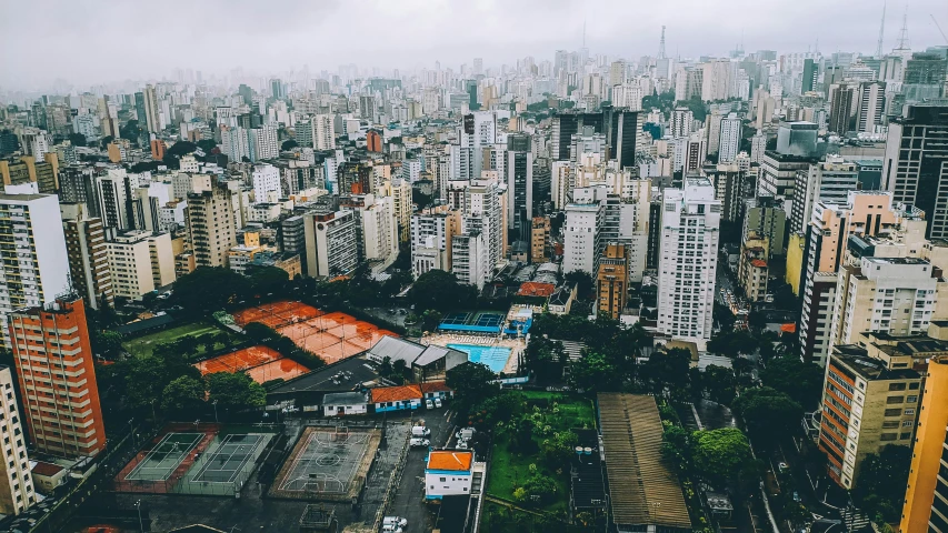 a view of a city from the top of a building, icaro carvalho, flatlay, while it's raining, schools