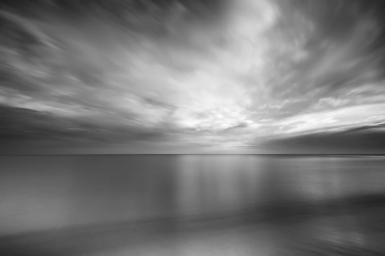 a black and white photo of the ocean, by Daniel Gelon, luminous skies, gradient brown to silver, motionblur, hd wallpaper