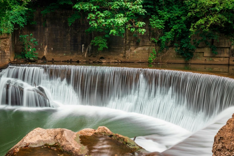 a waterfall flowing through a lush green forest, pexels contest winner, hurufiyya, erosion channels river, malaysia jungle, water wheel, panoramic shot