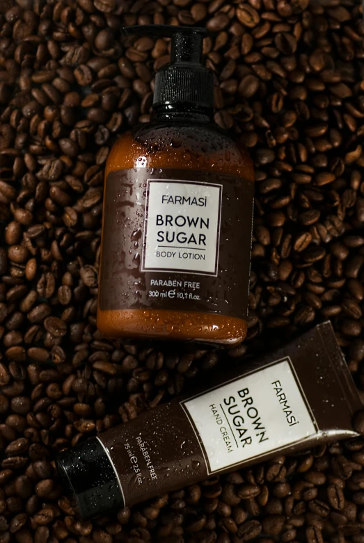 a bottle of brown sugar sitting on top of a pile of coffee beans, inspired by Francis Focer Brown, instagram, smooth tan skin, 3 - piece, thumbnail, worn