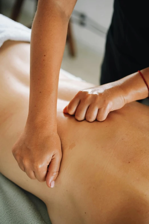 a man getting a back massage at a spa, by Arabella Rankin, full body close-up shot, handcrafted, average, lightweight