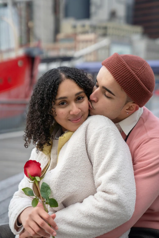 a man kissing a woman on the cheek, trending on pexels, renaissance, holding a rose, mixed race, on ship, promotional image