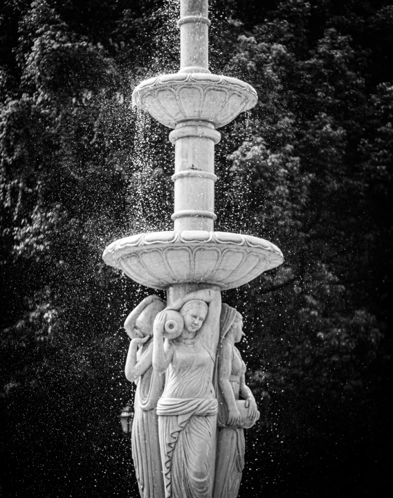 a black and white photo of a fountain, a marble sculpture, by Cherryl Fountain, art photography, splash image, outdoor photo, black & white photo, delightful surroundings