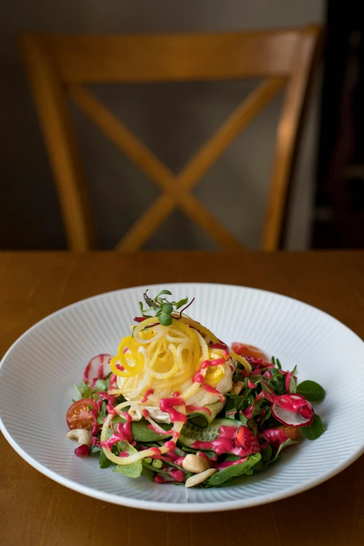 a close up of a plate of food on a table, by Sam Black, salad, rose twining, yellow, mayo