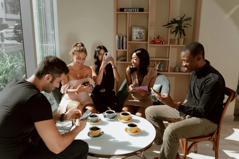 a group of people sitting around a table, pexels contest winner, happening, real trending on instagram image, lounge, black, casual game