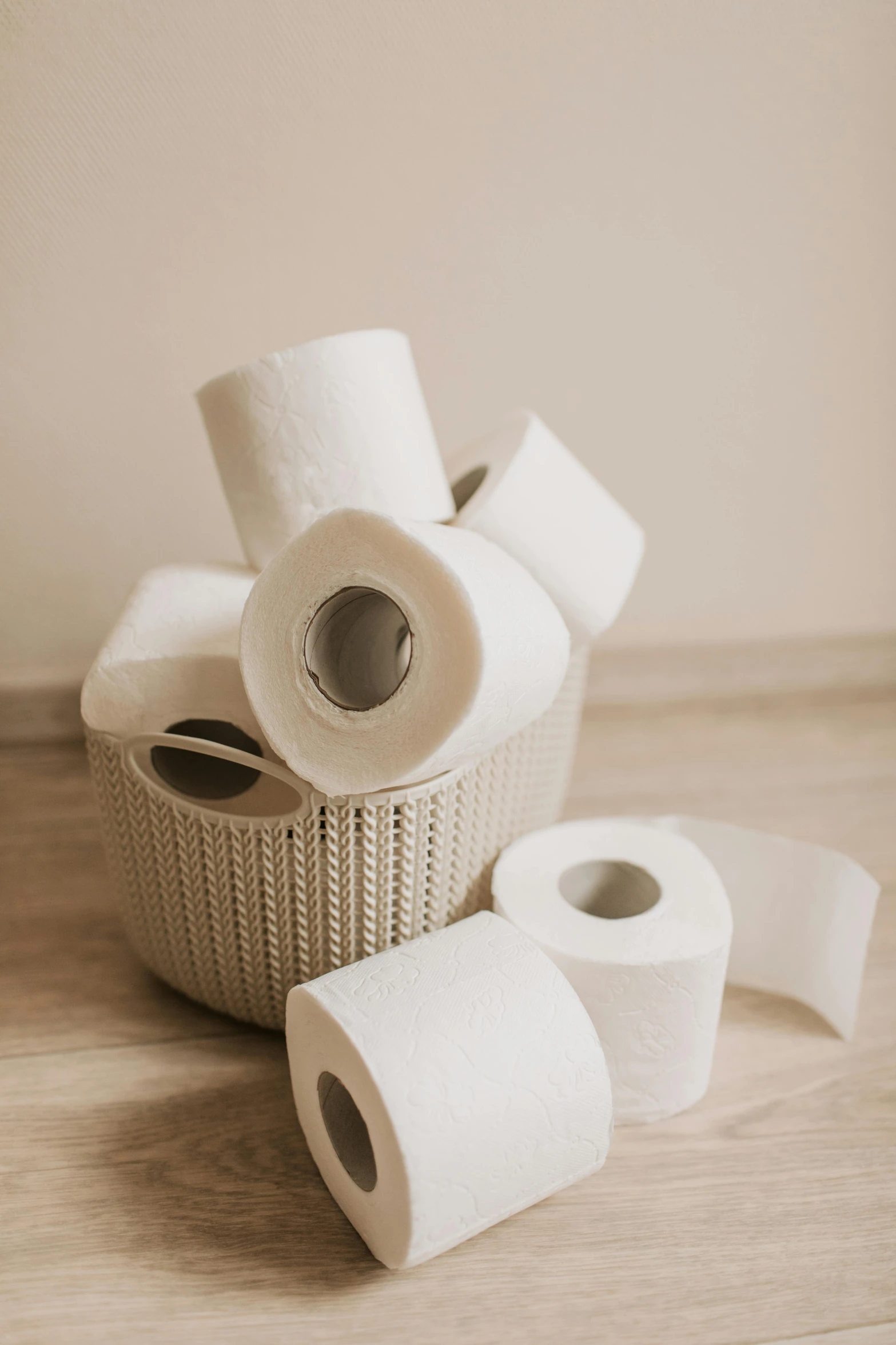 a basket filled with rolls of toilet paper, pexels contest winner, conceptual art, white ceramic shapes, warm light, used tape, sturdy body