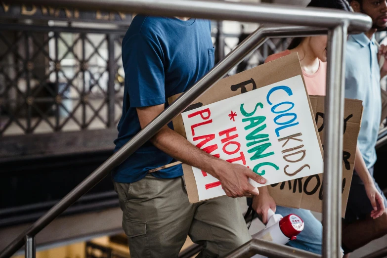 a group of people standing next to each other holding signs, a poster, by Julia Pishtar, pexels contest winner, people shopping, made of cardboard, closeup, 15081959 21121991 01012000 4k