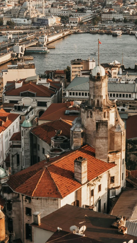 a view of a city from the top of a building, inspired by Almada Negreiros, pexels contest winner, art nouveau, silo, port, brown, thumbnail