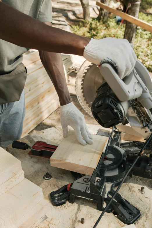 a man cutting wood with a circular saw, pexels contest winner, gloves on hands, bulky build, inspect in inventory image, thumbnail
