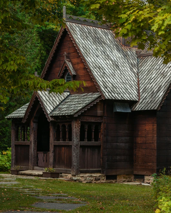 a small wooden building sitting in the middle of a forest, pexels contest winner, arts and crafts movement, churches, swedish house, ukraine. photography, multiple stories