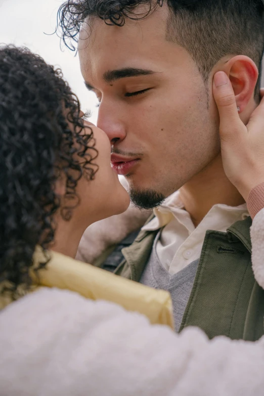 a man kissing a woman on the cheek, trending on pexels, curls on top, romantic lead, mixed race, gif