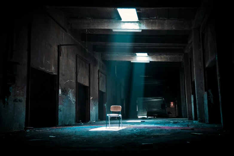 a chair that is sitting in the middle of a room, inspired by Elsa Bleda, pexels contest winner, conceptual art, abandoned night hangar, horror movie lighting, instagram post, abandoned asylum