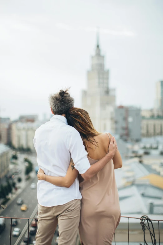 a man and a woman standing on top of a building, moscow, cuddling, but minimalist, overlooking