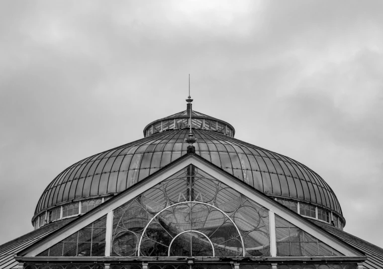 a black and white photo of a building, a black and white photo, inspired by Thomas Struth, unsplash contest winner, mystical kew gardens, rounded roof, glasgow, photographic print
