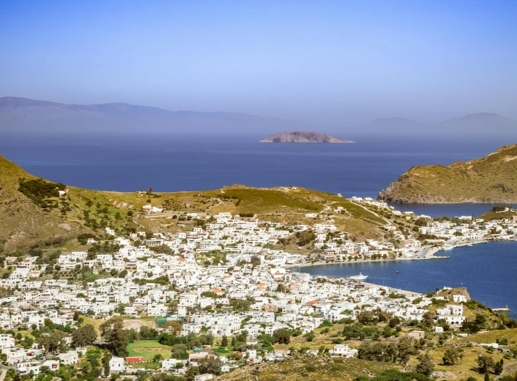 a large body of water sitting next to a lush green hillside, pexels contest winner, renaissance, hydra, city panorama, square, thumbnail