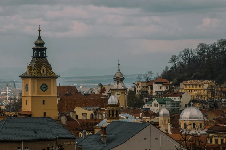 a large clock tower towering over a city, by Emma Andijewska, pexels contest winner, renaissance, romanian heritage, panoramic view, domes, 2 0 0 0's photo