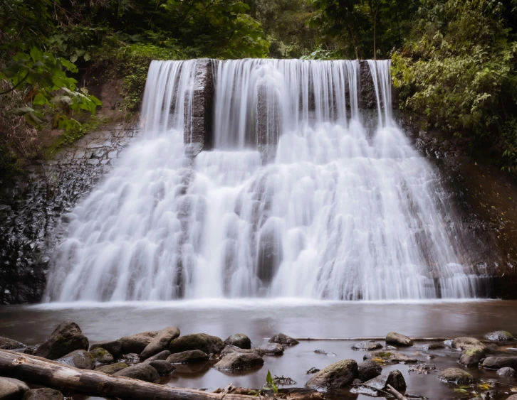 a waterfall in the middle of a forest, by Jan Rustem, unsplash, hurufiyya, fan favorite, kahikatea, brown, pristine and clean