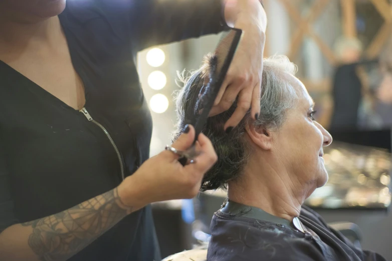 a woman getting her hair cut at a salon, pexels contest winner, balding older cyborg repairing, profile image, thumbnail, te pae