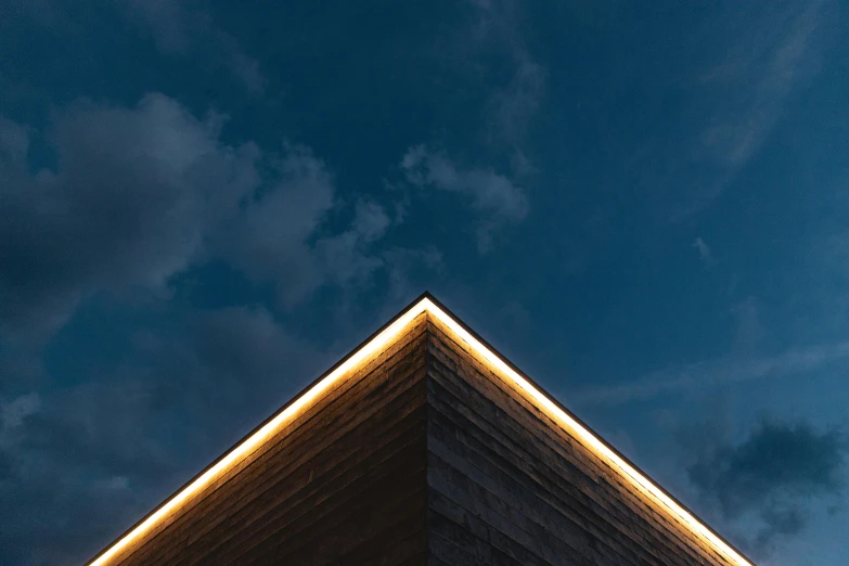 a close up of a building with a sky in the background, an album cover, inspired by Peter Zumthor, unsplash contest winner, minimalism, neon glowing wood, triangle, edge lighting, profile image