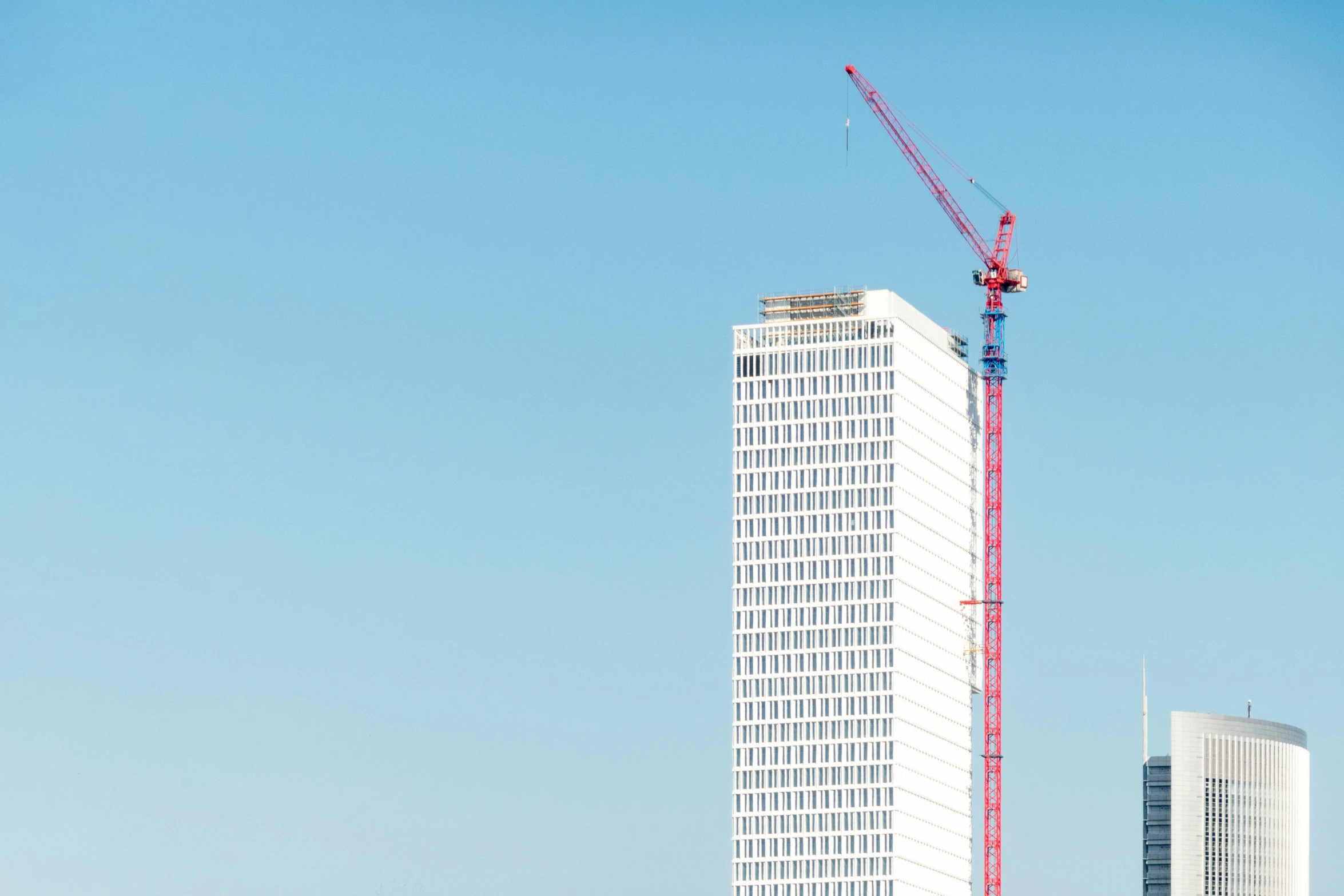 a very tall building with a crane on top of it, pexels contest winner, bauhaus, herzog de meuron, clemens ascher, ground-breaking, panoramic