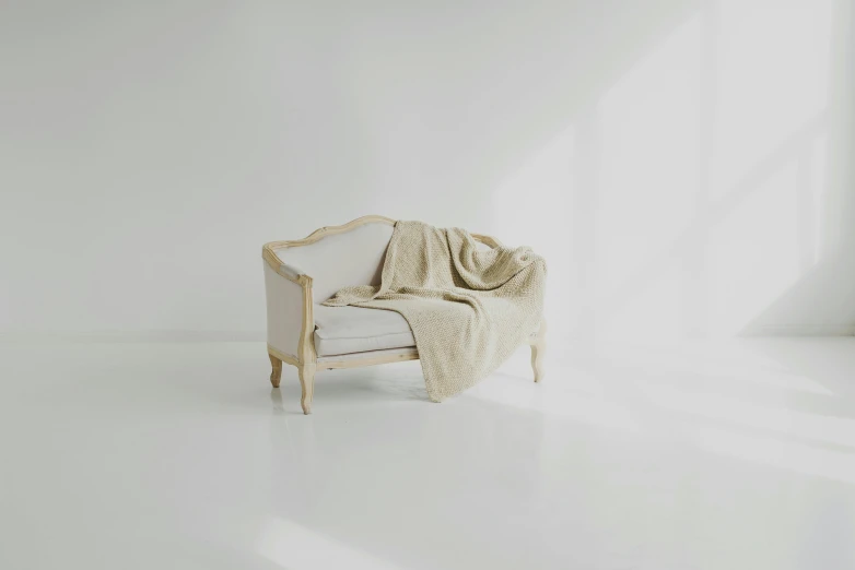 a chair with a blanket on it in a white room, trending on pexels, rococo, beige cream natural muted tones, regal aesthetic, old couch, v ray
