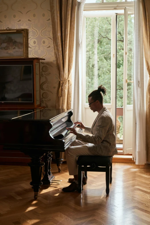 a woman sitting at a piano in a living room, pexels contest winner, fine art, in balcony of palace, portrait of willow smith, handsome man, italy